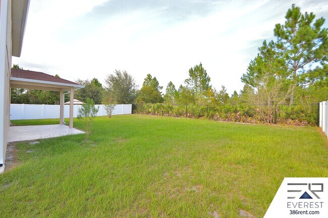 Building Photo - SPACIOUS, FULLY FENCED 4/2.5/2 IN DESIRABLE MATANZAS WOODS