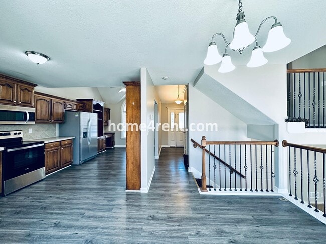 Building Photo - Spacious Four Bedroom Northland Home with a Finished Basement, 3 car garage and Fenced Yard!