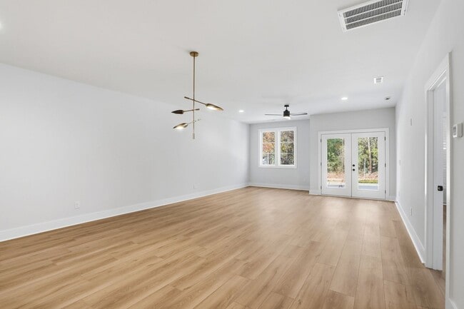 Building Photo - Bright, Open & Exceptionally Large—Your Ideal 2-Story Townhome