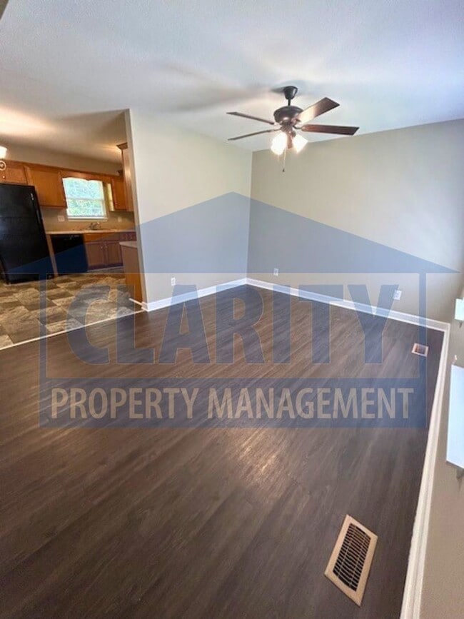 Building Photo - Charming three-bedroom home with carport!