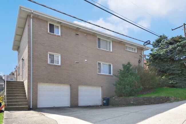 Designated driveway and garage space on side of property - 3101 Clermont Ave