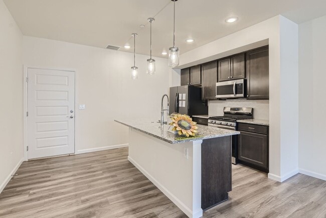 Building Photo - Beautiful 2-story modern townhome available for rent in booming Interquest & Voyager area