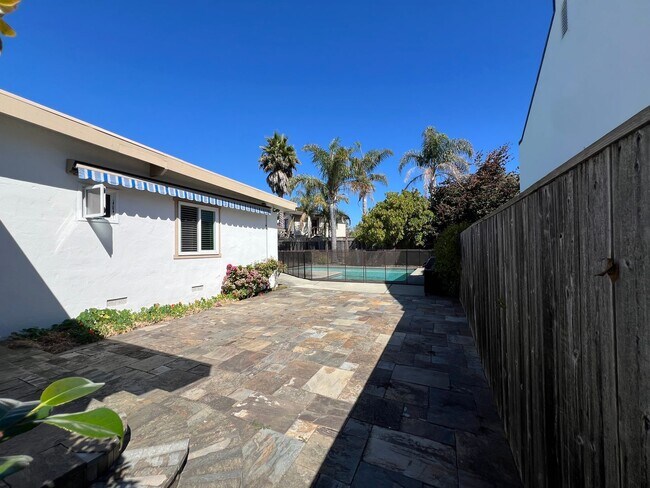Building Photo - Spacious 4-Bedroom Retreat Just Steps from...