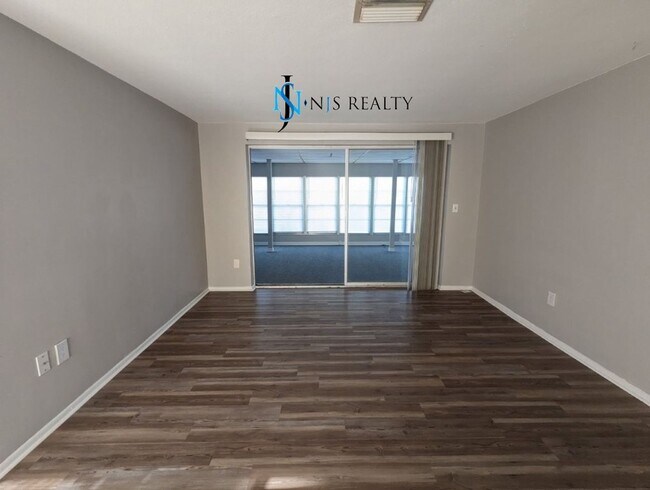 Building Photo - Just Reduced!  2/2/1 with  RENOVATED baths & kitchen, fenced yard, NEW lvp flooring and a OVERSIZ...