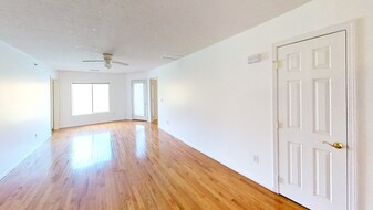 Living Room, large windows overlooking river - 7311 University Commons Dr