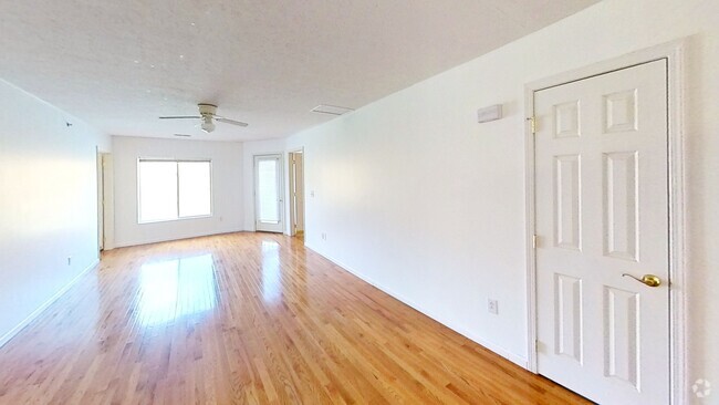 Living Room, large windows overlooking river - 7311 University Commons Dr