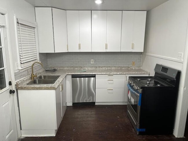 Building Photo - 2/1 NEW PAINT AND FLOORING - NEWLY RENOVATED