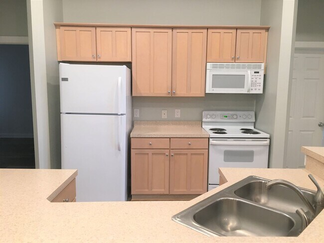 Building Photo - Inviting, modern two bedroom with garage parking, balcony views and a wonderful location in Chape...