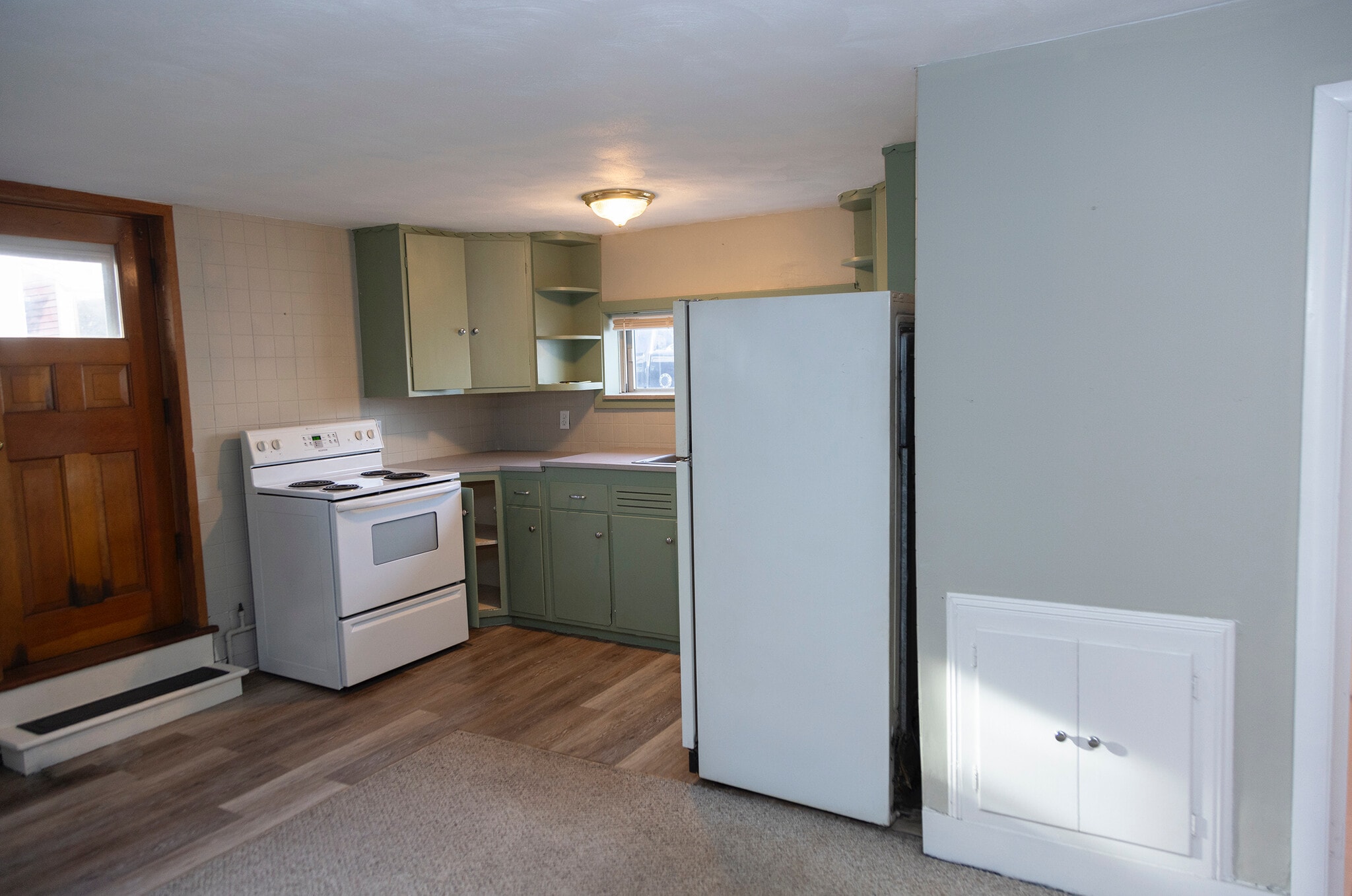 Kitchen with second entrance door - 63C Brewster Ave