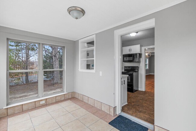 Building Photo - Brick home, Two Story, Hardwoods, DR, 2 Sun Rooms, FP, Carport!.