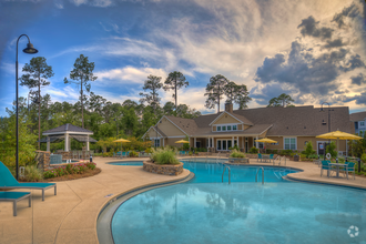 Resort-style swimming pool and clubhouse - Lullwater at Blair Stone