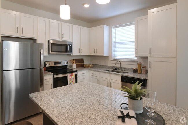 Gourmet Kitchen with Granite Countertops, White Shaker Cabinets & Stainless Steel Appliances