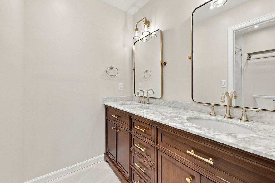 Updated primary bath with a spacious double vanity - 3622 Caroline Vale Blvd