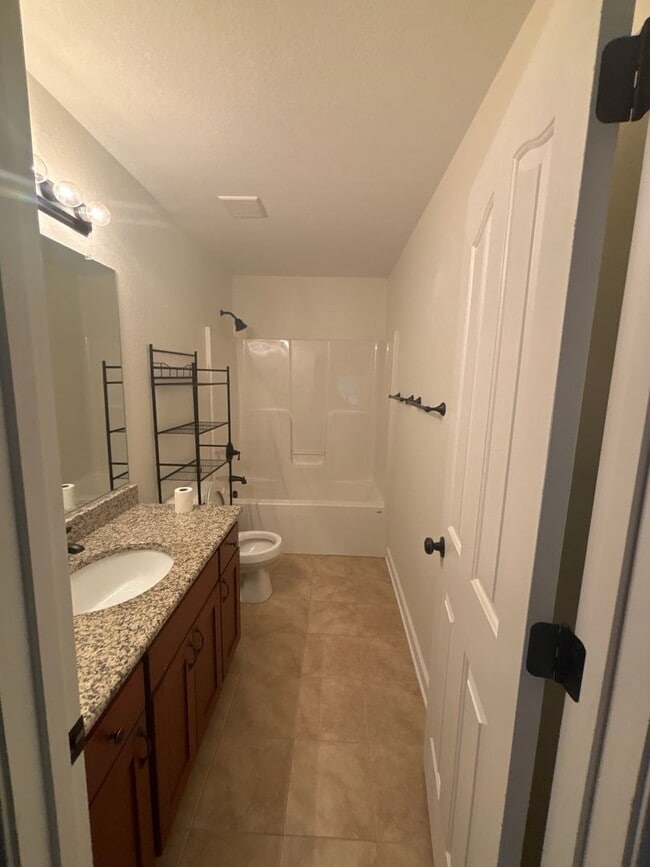 Building Photo - Spacious 4-Bedroom Home Near Base – No Tun...