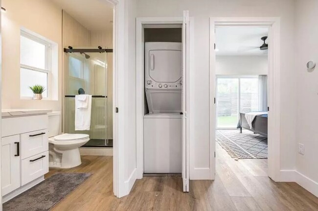 View from the foyer of the guest bathroom, laundry, and master bedroom. - 3355 Lloyd St