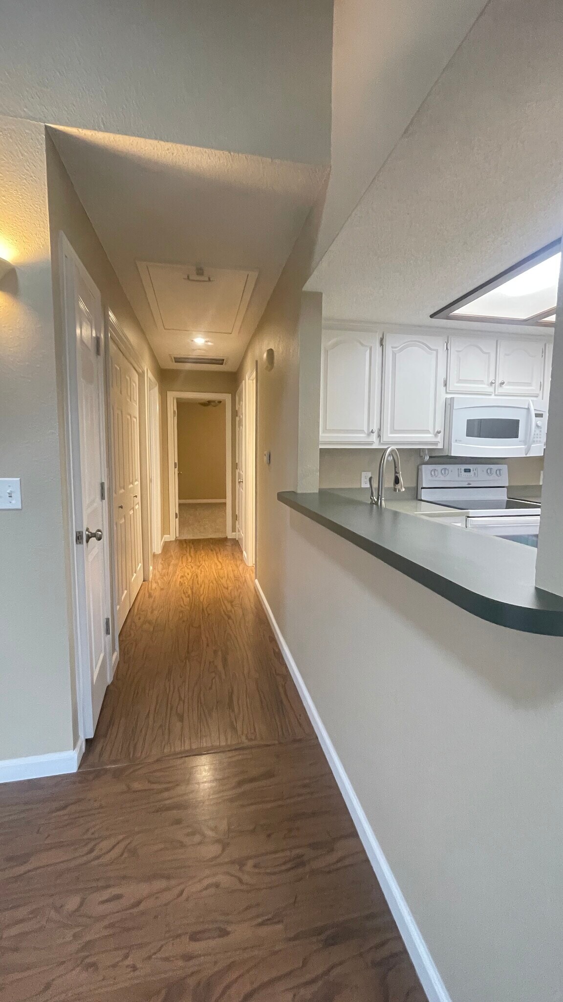 Hallway to rest of home - 3440 S Delaware Ave