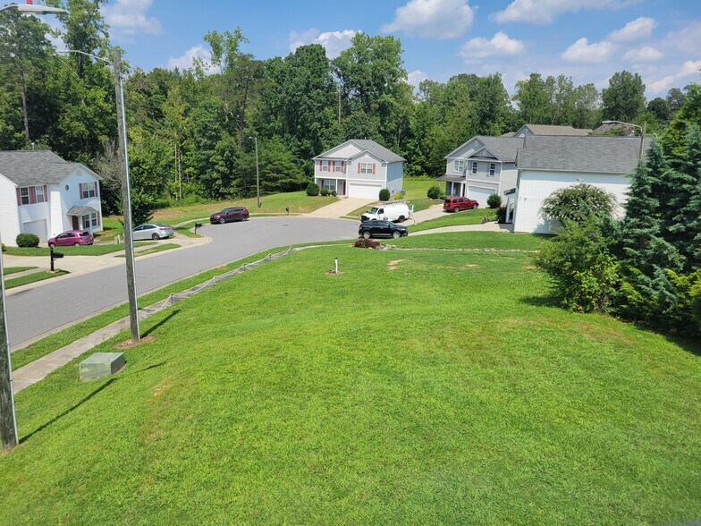 The corner lot is large and elevated, perfect for entertaining or enjoying with the family. - 6903 Seney Dr