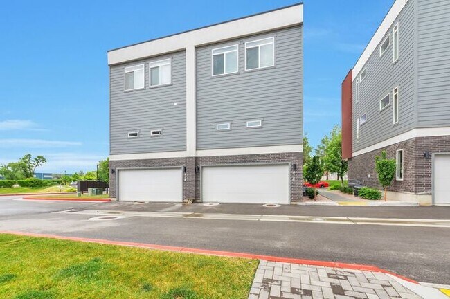 Building Photo - Modern End Unit townhouse w attached 2 car...