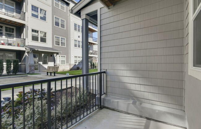 Building Photo - Modern Ground-Level Condo in River Terrace...