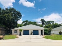 Building Photo - Experience this Cape Coral 3 bedroom 2 bath duplex with 1 car garage and screened in lanai.