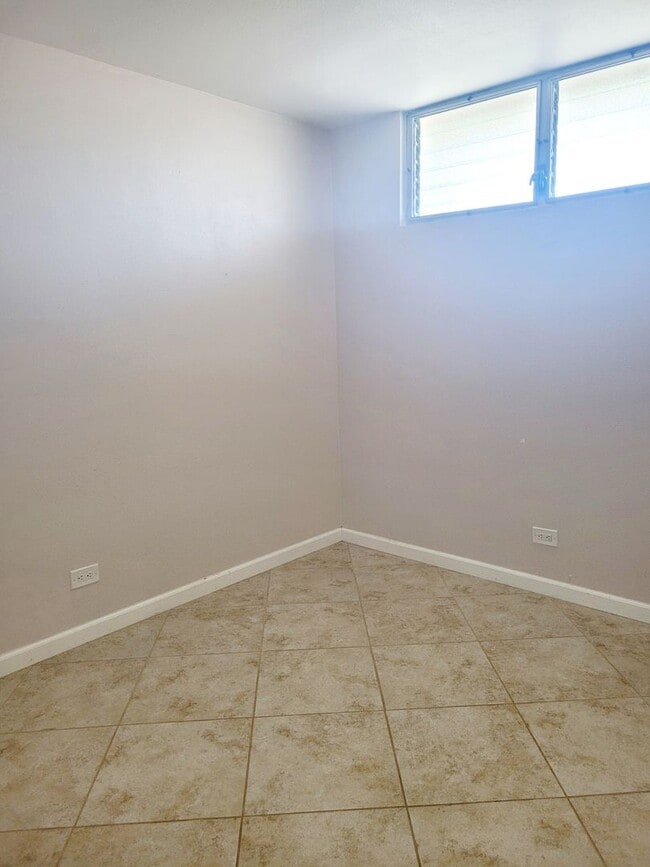 Building Photo - AVAILABLE | 2 Bedroom, 1 Bathroom Condo with 1 Assigned Parking Stall