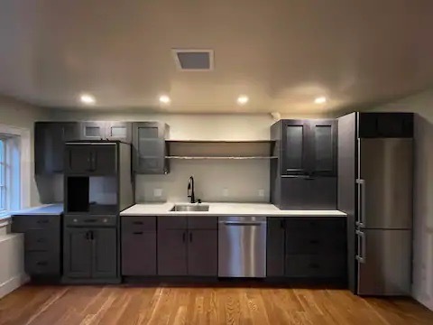 Kitchen - there is now a stove/oven where the tall cabinet is on the left. - 8 Freshwater Ln