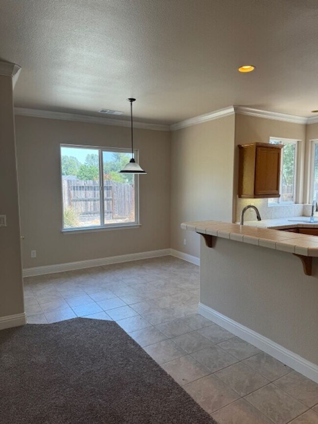 Building Photo - Enterprise Neighborhood 3 Bedroom Home with bonus room and 3 car garage- Landscaping Included!