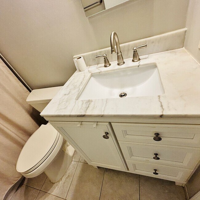 Building Photo - Spacious 3-Bedroom, 3-Bathroom Townhome with Finished Basement, Garage & Fenced Yard