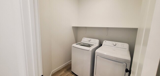 Building Photo - Beautifully designed modern townhome with attached garage.