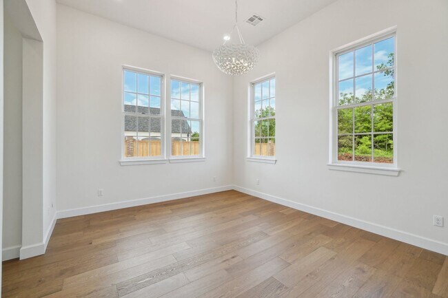 Building Photo - Classic Cape Cod Meets Modern Glam: Your D...