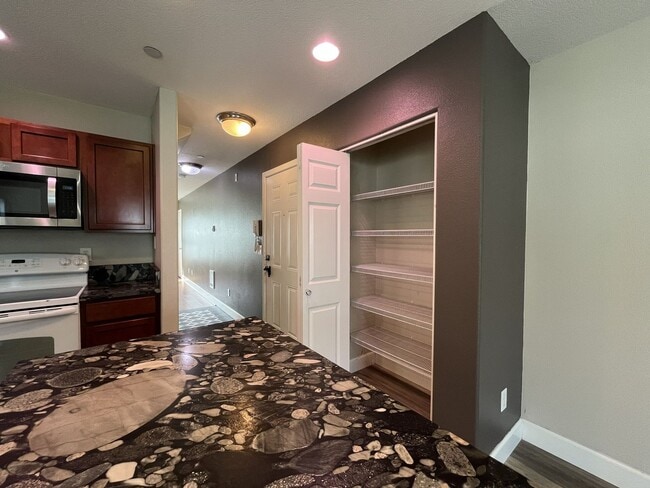 Building Photo - Incredible SE Hazelwood 2 Bedroom + 1 Bathroom Condo w/ included Garage and Washer & Dryer!!