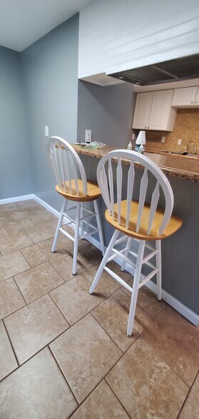 Entry way from garage across from barstools. - 313 Britanna Dr