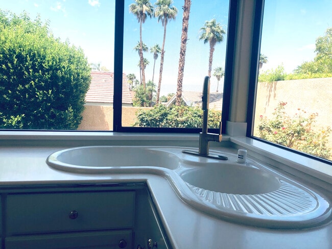 Kitchen corner sink faces mountain views - 72836 Mesa View Dr