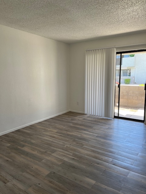 Empty bedroom (popcorn ceilings have been removed) - 6480 N 82nd St