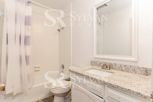 Building Photo - Feel welcome and comfortable in this spaci...