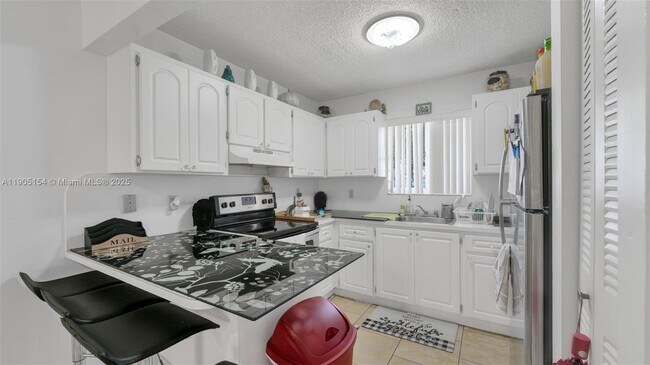 Building Photo - 7935 W 30th Ct