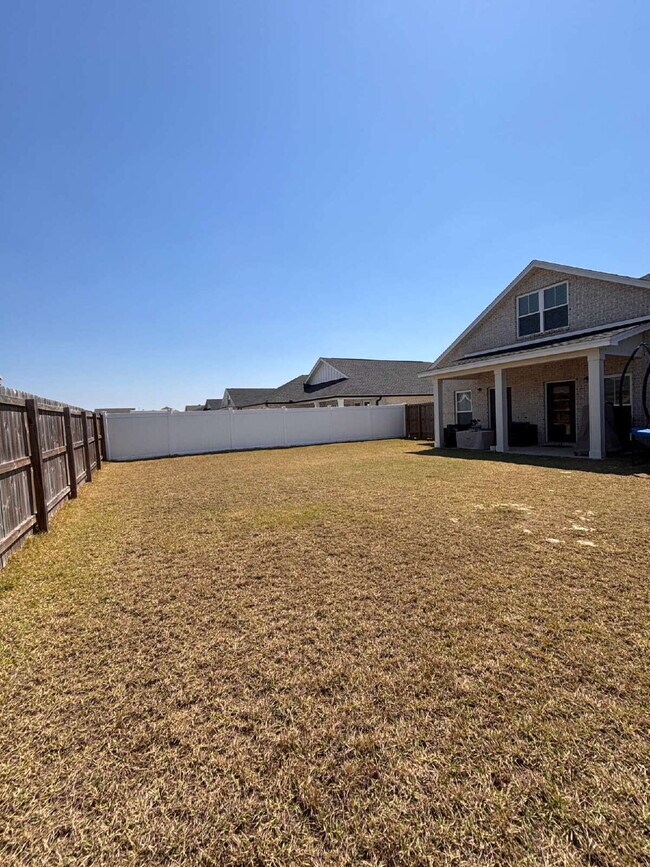 Building Photo - Need Space?  How about 5 bedrooms, 2.5 baths + an extra bonus area upstairs so that the kids can ...