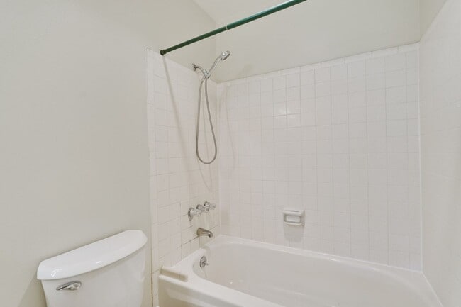 Building Photo - Top Floor Unit - Balcony - Elevator Access - Community Pool & Tennis Court