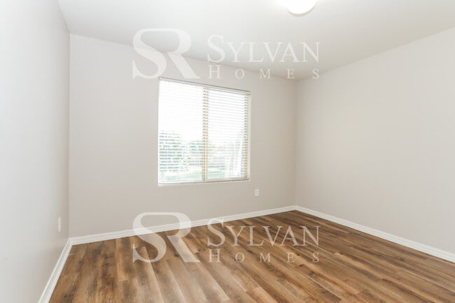 Building Photo - The living is easy in this 5 bedroom, 3 ba...