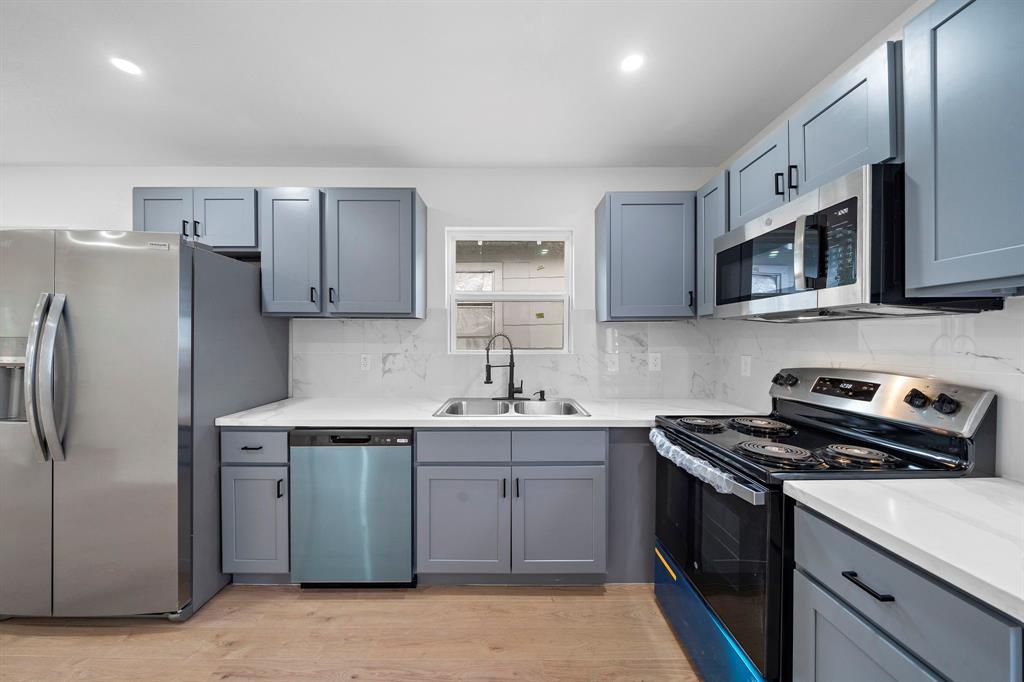 Upgraded kitchen with new appliances. - 2312 Lucinda St