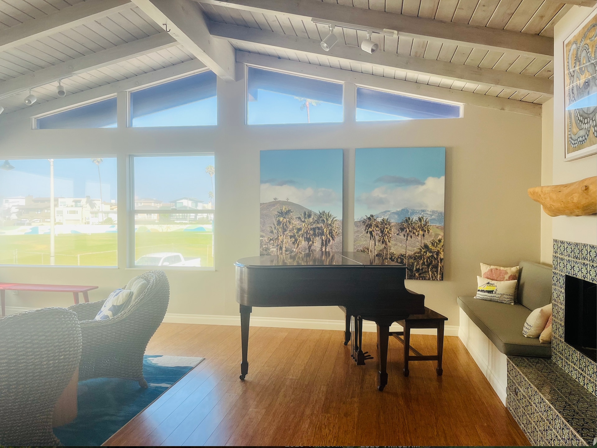 Living room has a fireplace and baby grand piano. - 1248 Marthas Vineyard Ct