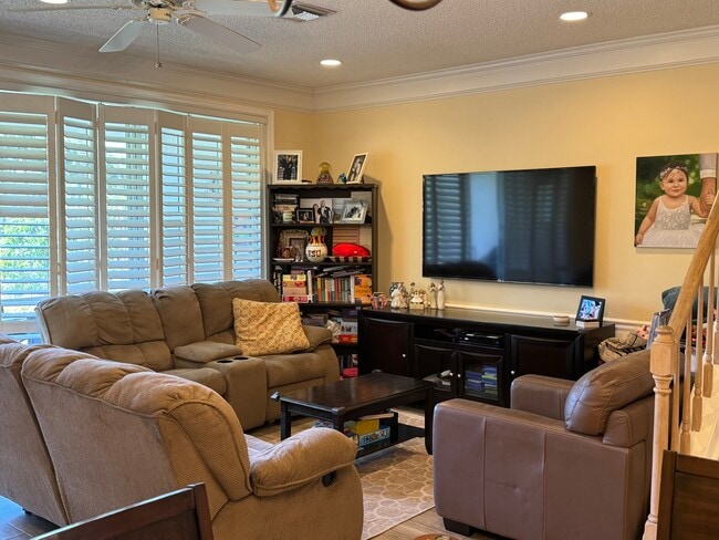 Plantation shutters and large, open concept living area - 21478 Saint Andrews Grand Cir