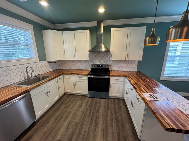 Building Photo - Modern Bungalow Charm: Designer Finishes & Expansive Backyard Living!