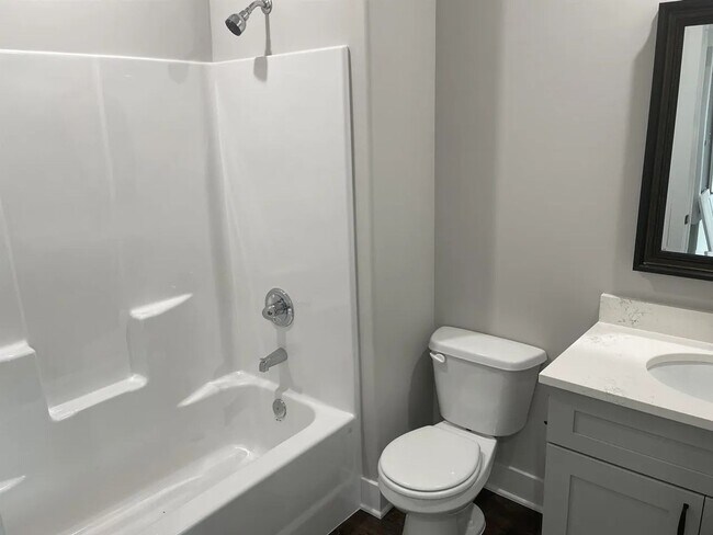 Building Photo - Single family slab home with three car garage. This home is 4 bedrooms, three bathrooms open floo...