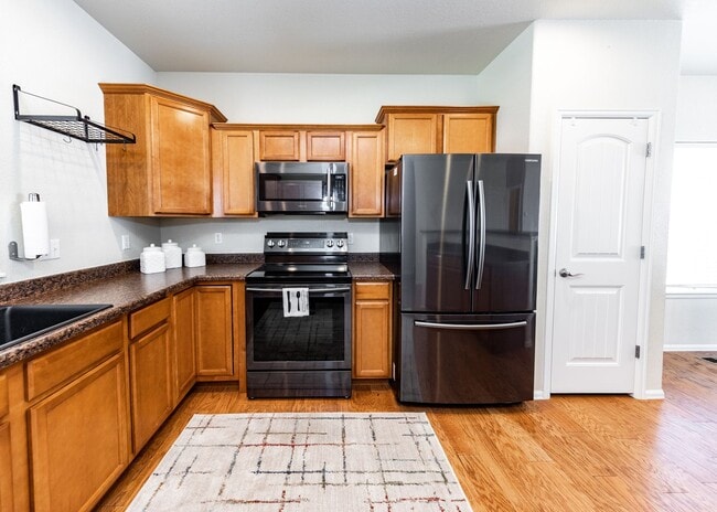 Building Photo - Cute End Unit 3 Bedroom Townhome in Lorson Ranch Next to Open Space