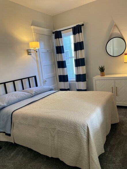 Full sized bed in secondary bedroom. - 28 Saint James Pl