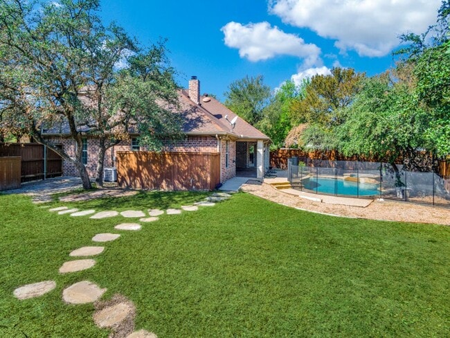 Building Photo - Incredible 4-bedroom, 3-bath Home with sparkling Pool on a gorgeous lot in highly sought-after Al...