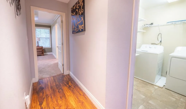 Laundry Room (W/D included) to the right. Main bedroom ahead. - 12366 Copperwood Dr