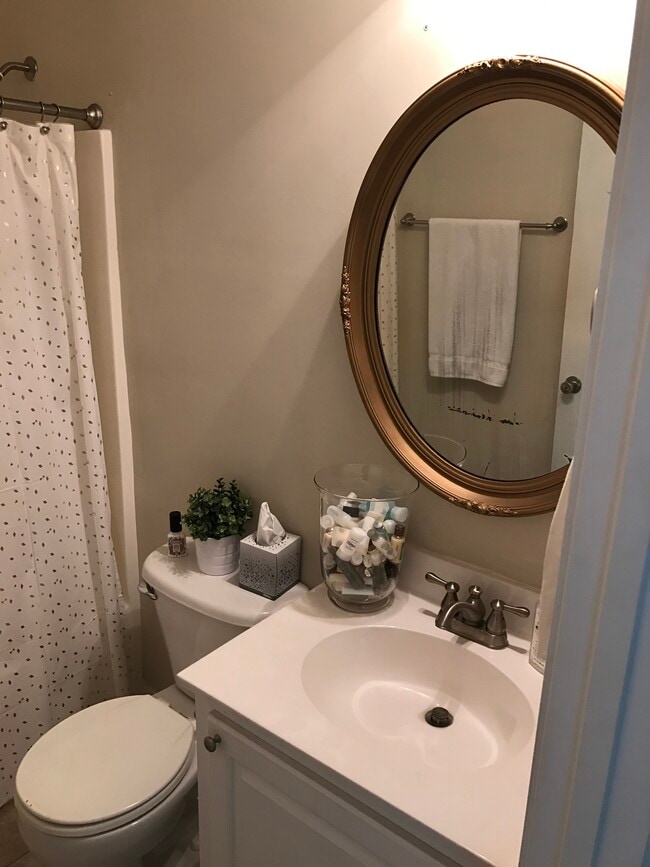 Hallway bathroom which is shared by two bedrooms in the front of the home. - 3406 Margrave Rd