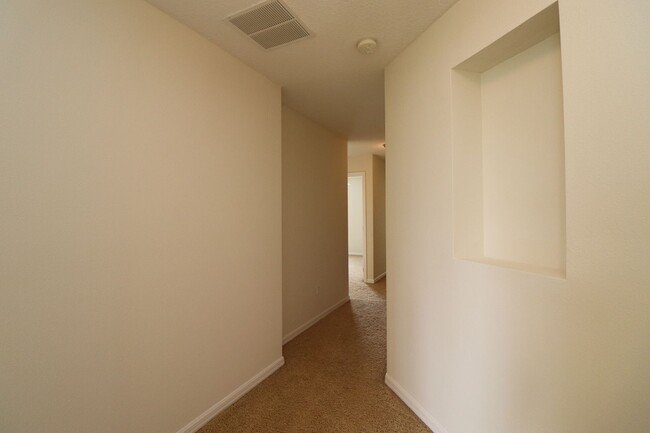 Building Photo - Town home 2 story, 3/2.5/1 backing up to T...